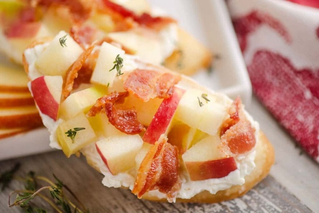 Apple bacon bleu cheese crostini close up shot.