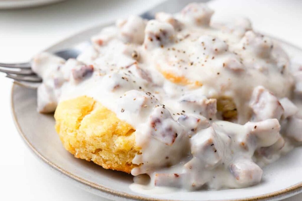Close up shot of biscuits and gravy.