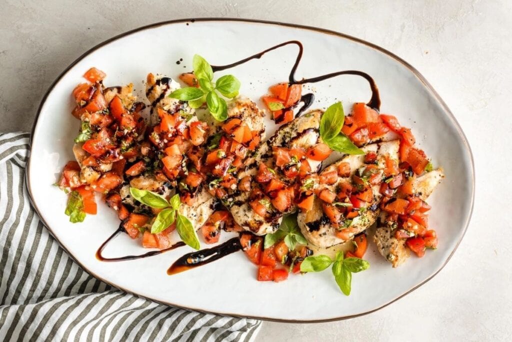 Bruschetta chicken on a plate.