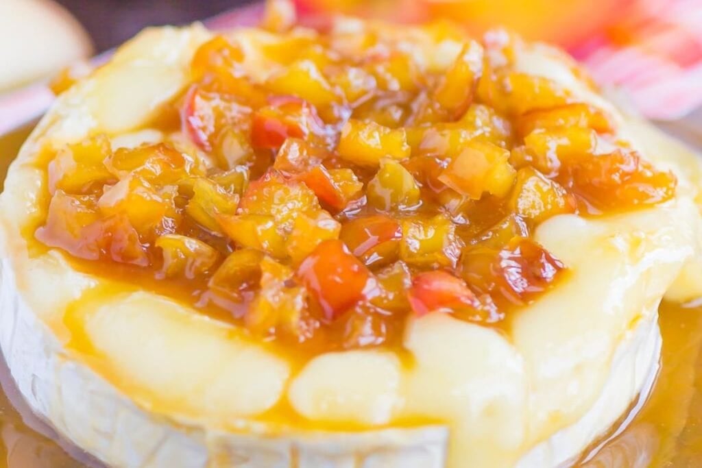 Close up shot of caramel apple baked brie.