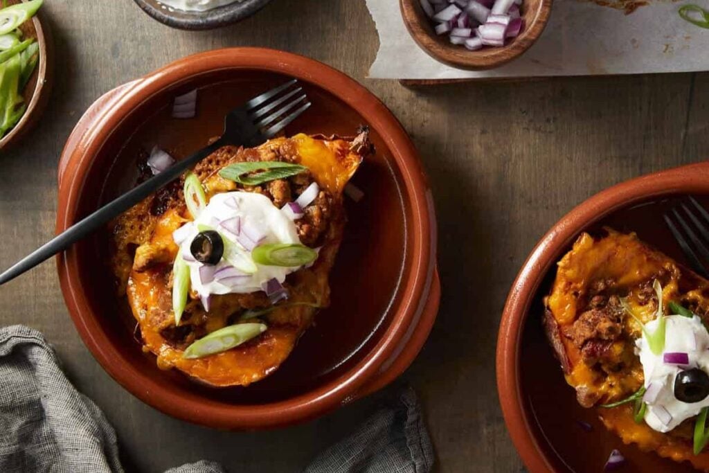 Two bowls of stuffed sweet potatoes.