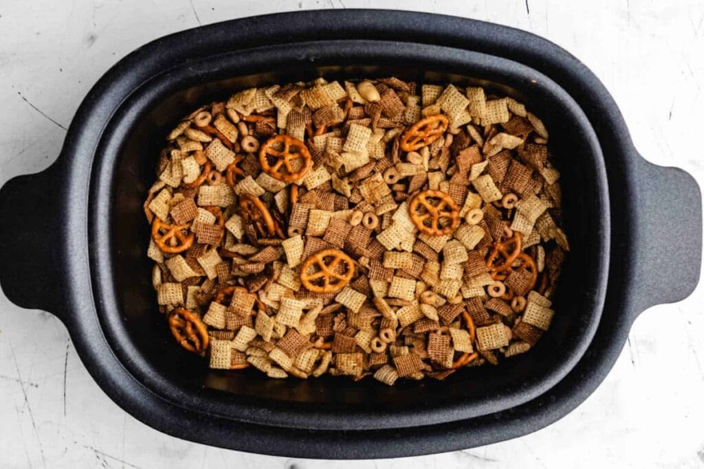Chex mix in a sloe cooker.