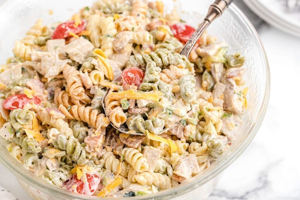A bowl of chicken ranch pasta salad.