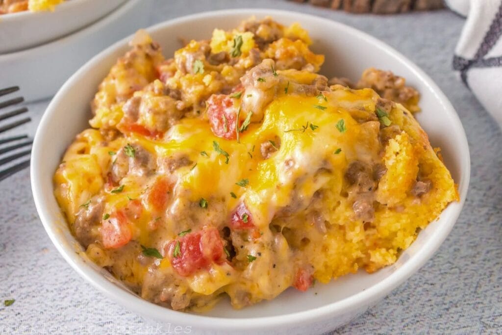 A bowl of cornbread ground beef casserole.