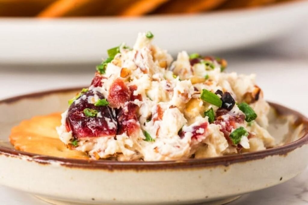 Cranberry cheeseball on a plate.