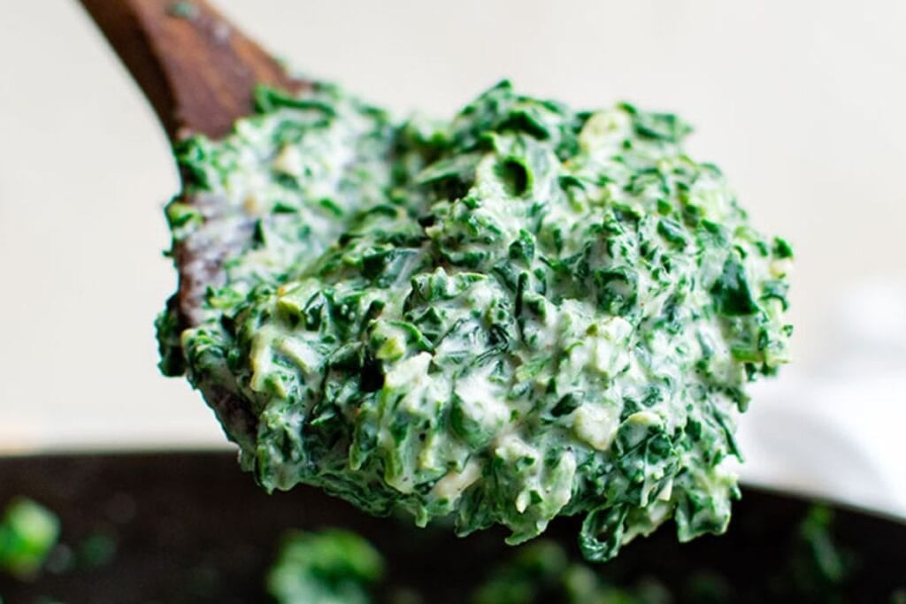A close up shot of creamed spinach.
