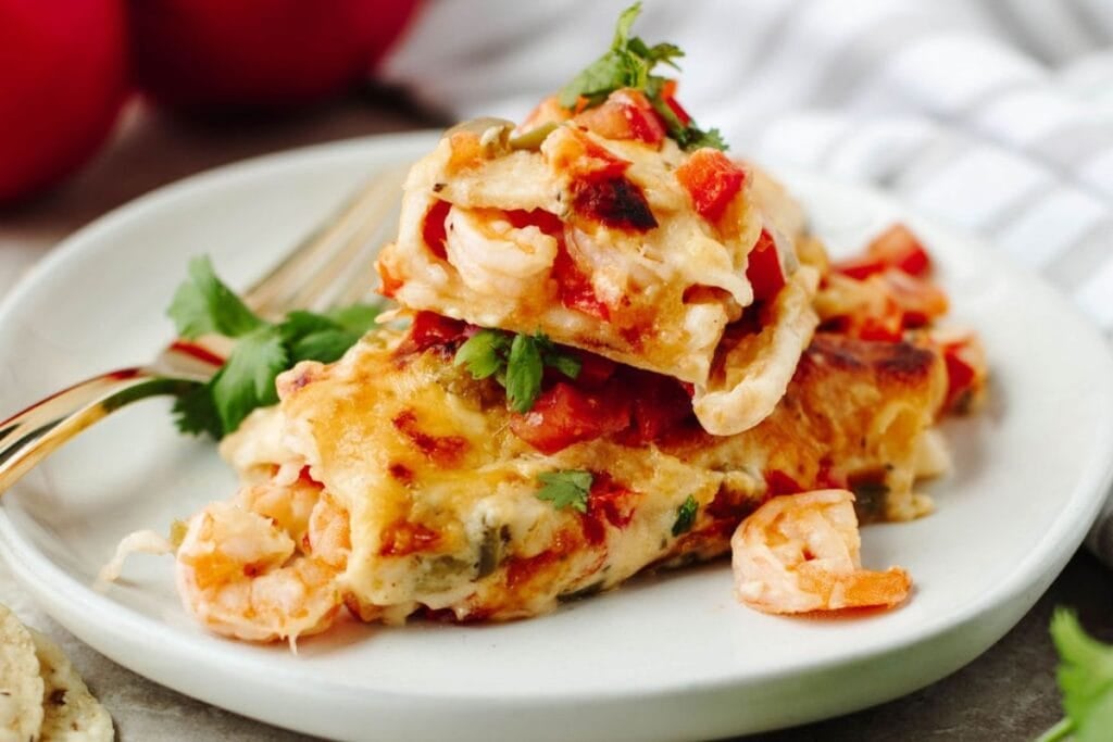 Close up shot of shrimp enchiladas.