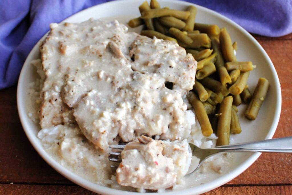 Pork chops on a plate.