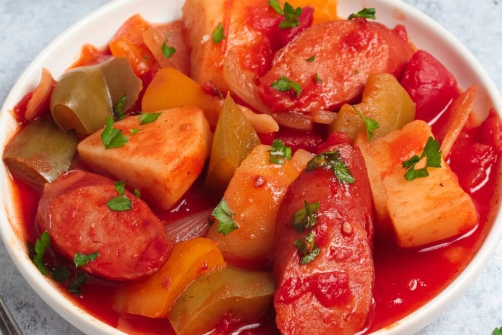 Sausage and potatoes in a bowl.