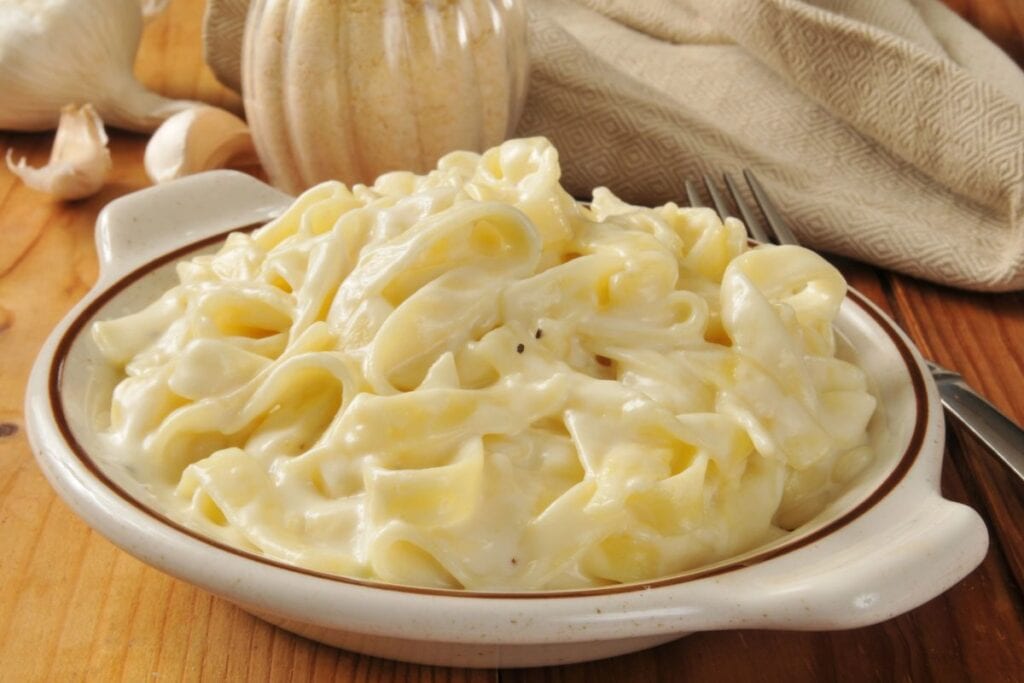 Fettuccini Alfredo in white bowl.