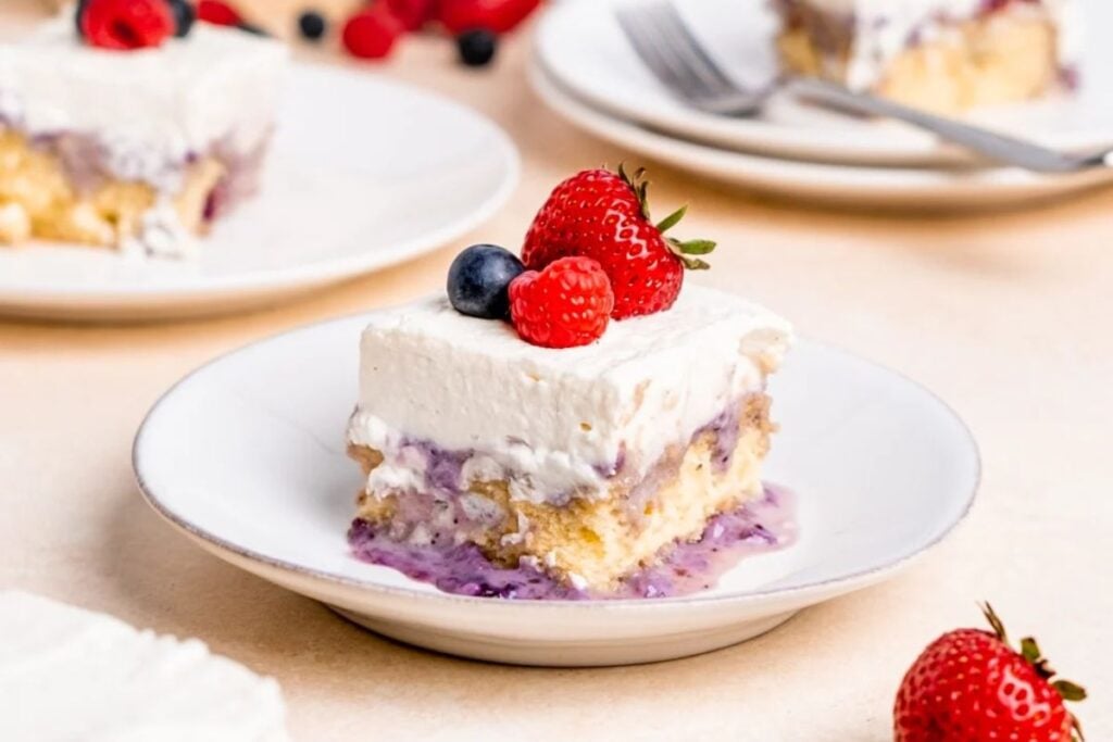 A slice of milk and berries cake.