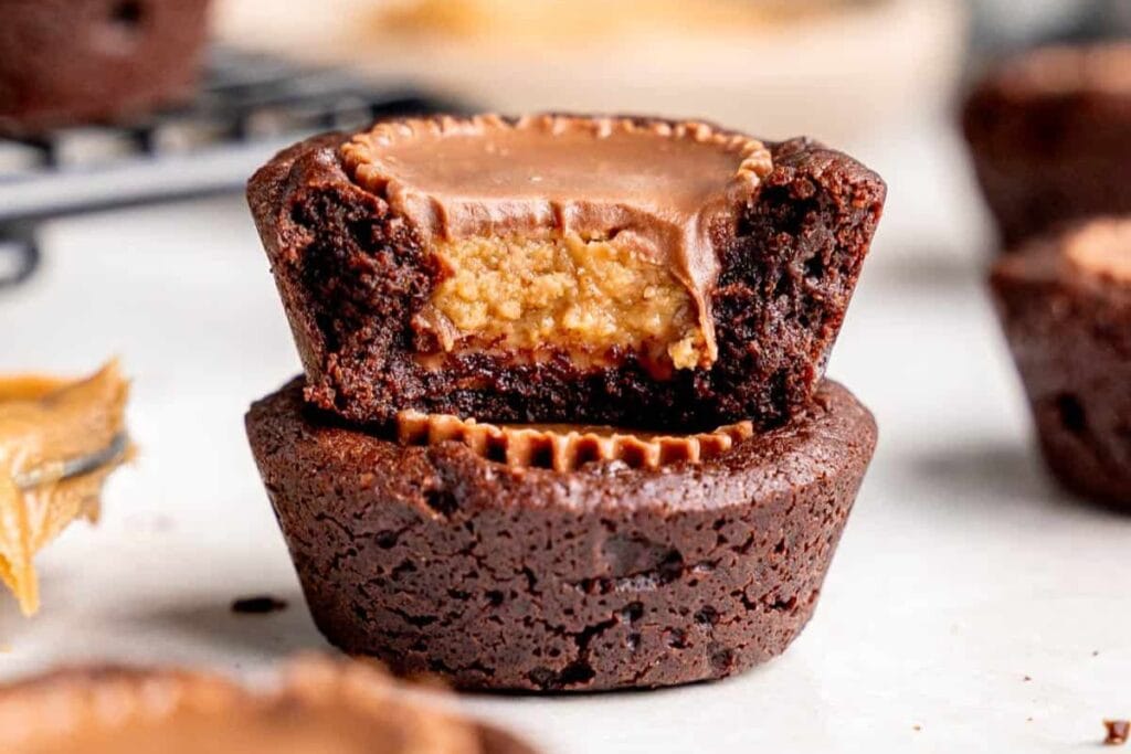 Peanut butter cup brownies on a white surface.