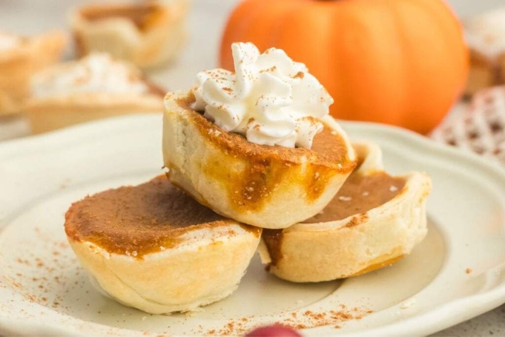 Mini pumpkin pies on a plate.