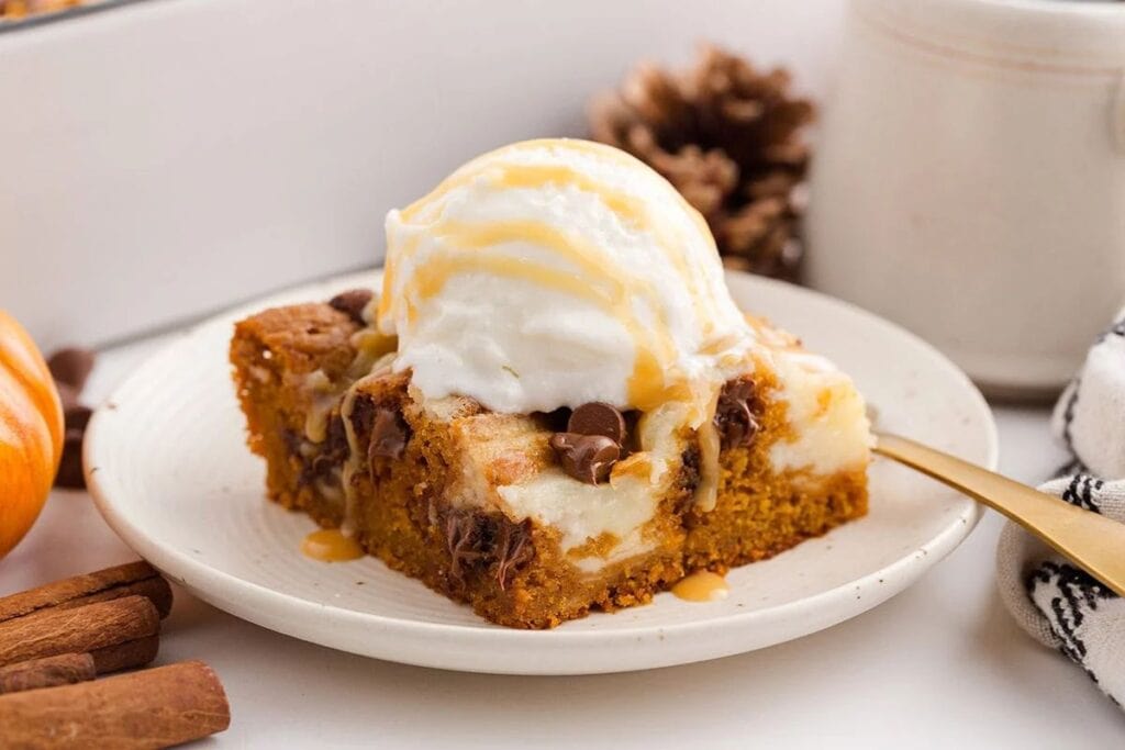 A slice of pumpkin earthquake cake on a plate.