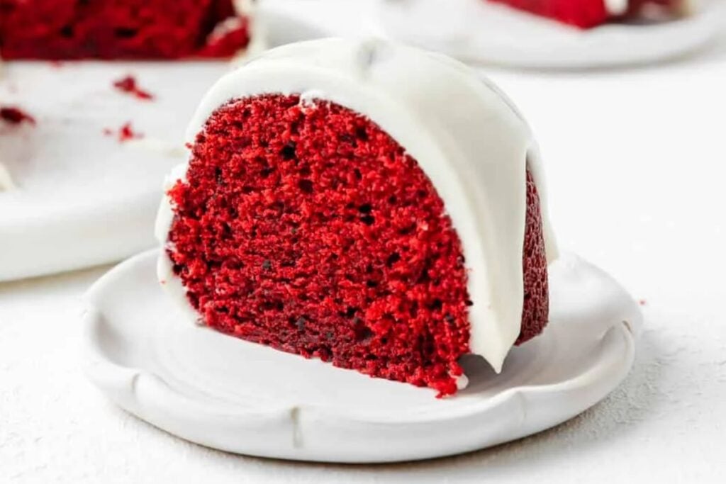 A slice of red velvet bundt cake on a plate.