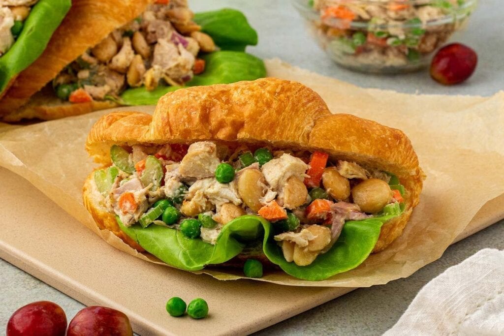 A close up shot of chicken salad sandwich.