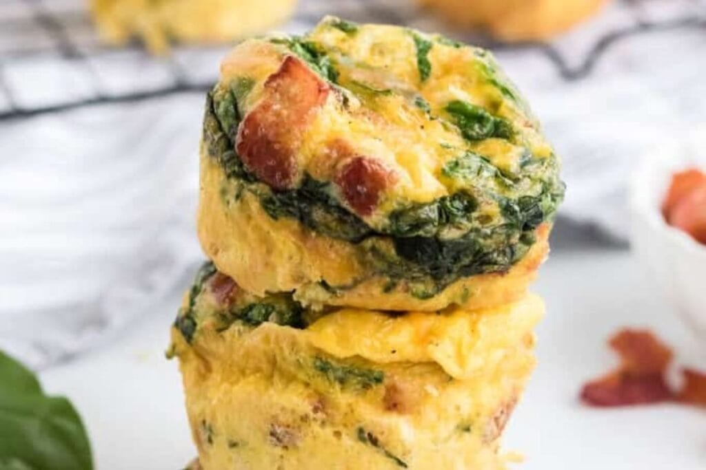 A close up shot of spinach and cheese egg muffins.
