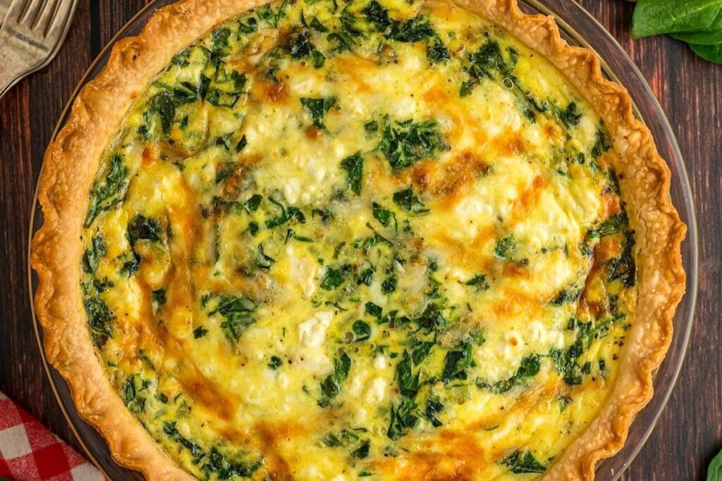 A close up shot of spinach feta quiche.