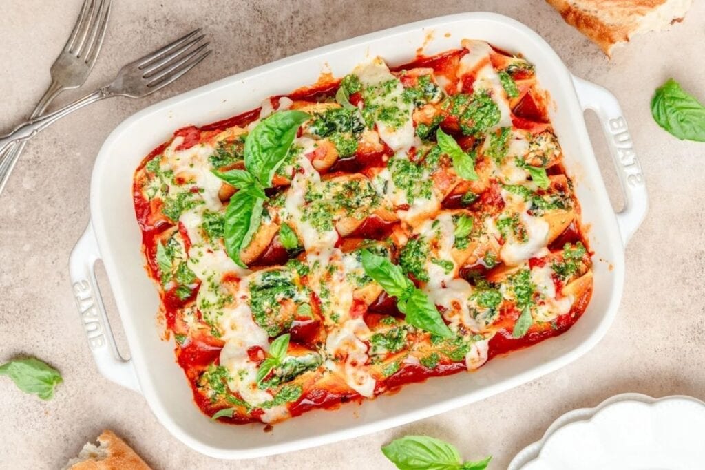 Spinach ricotta stuffed shells on a white dish.