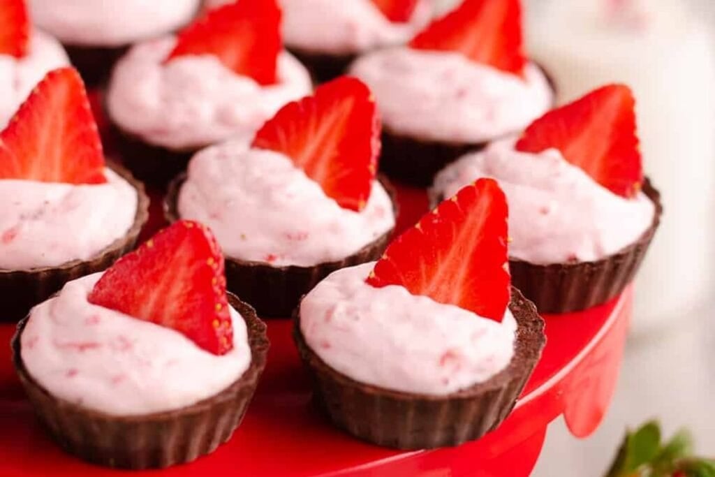 Dark chocolate mini cups with strawberries.
