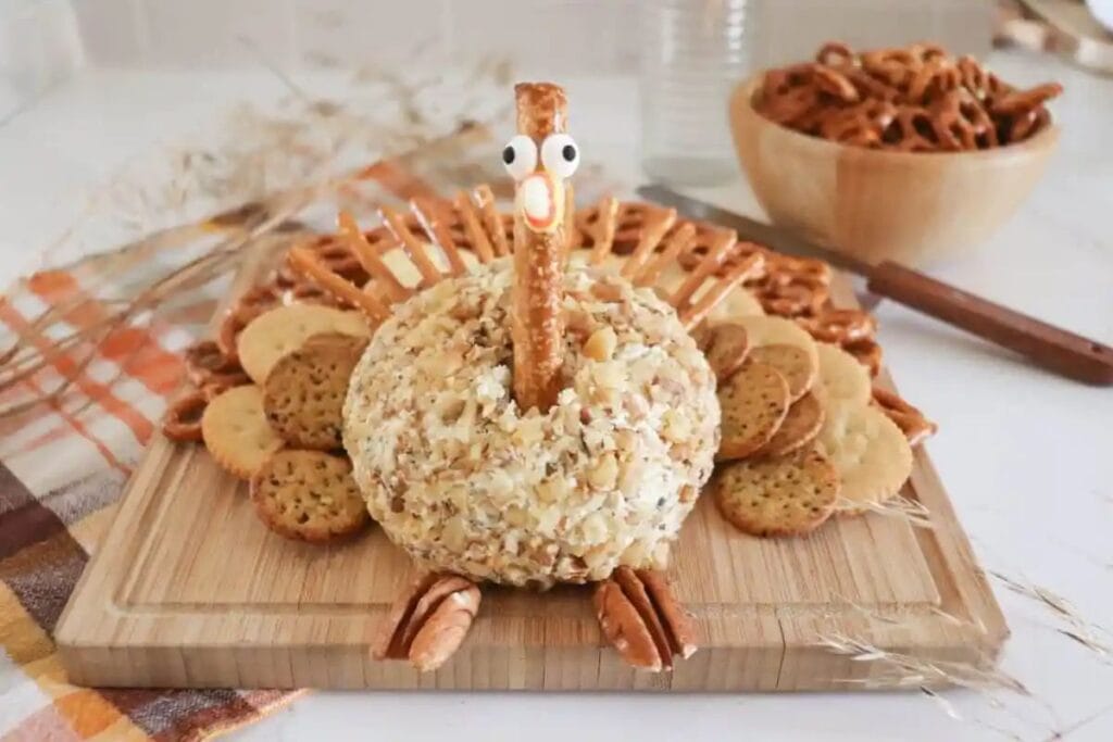 Turkey cheeseball on a wooden board.