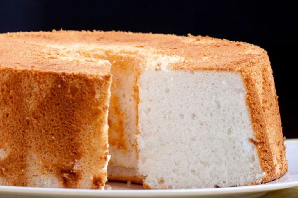 Fluffy angel food cake on a plate.