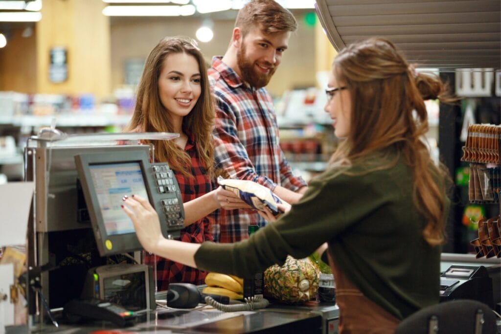 Customer at counter asking for discount on damaged item.