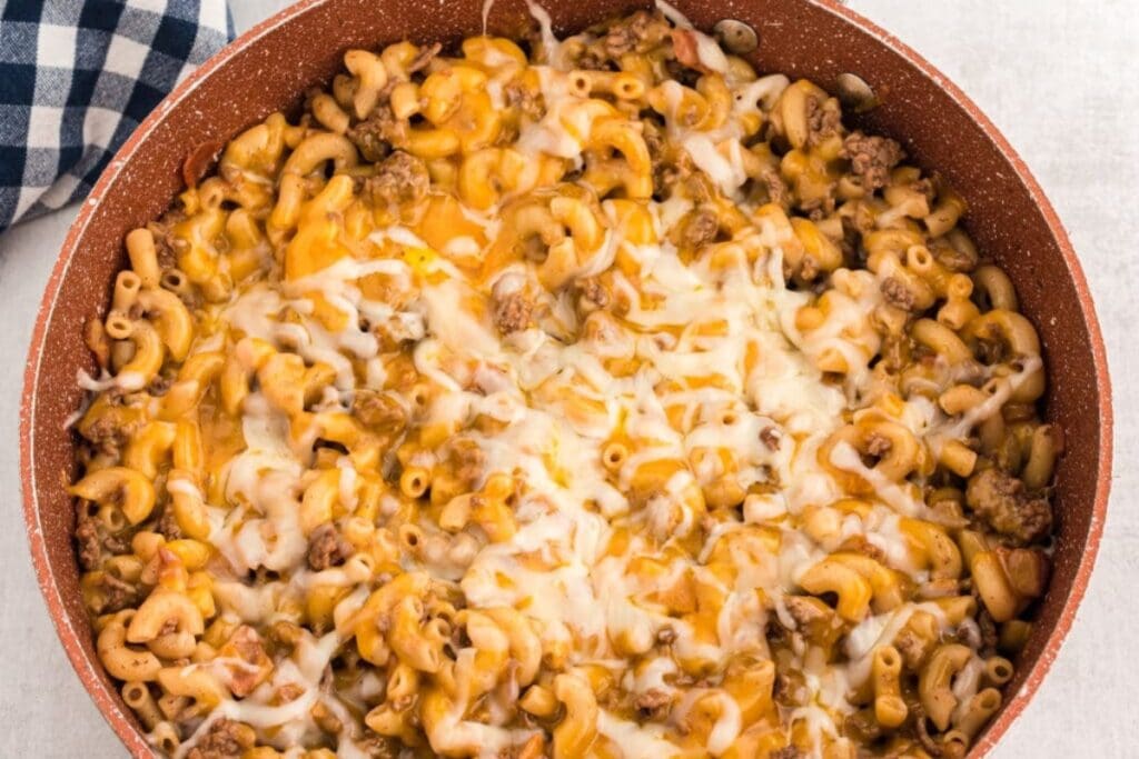 Bacon cheeseburger pasta in a skillet.