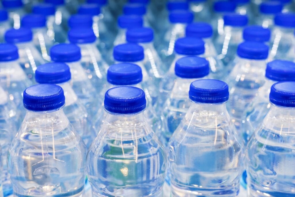 Numerous bottles of water neatly arranged.