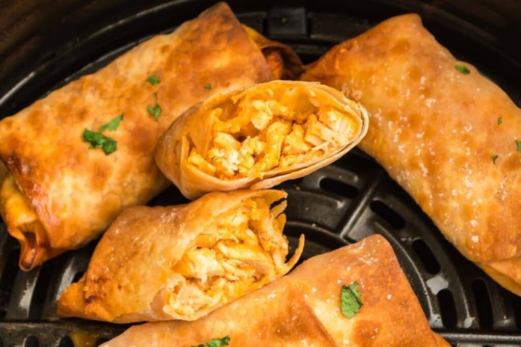Buffalo chicken egg rolls in an air fryer.