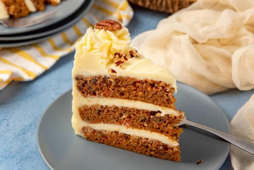 Slice of carrot cake on a plate.