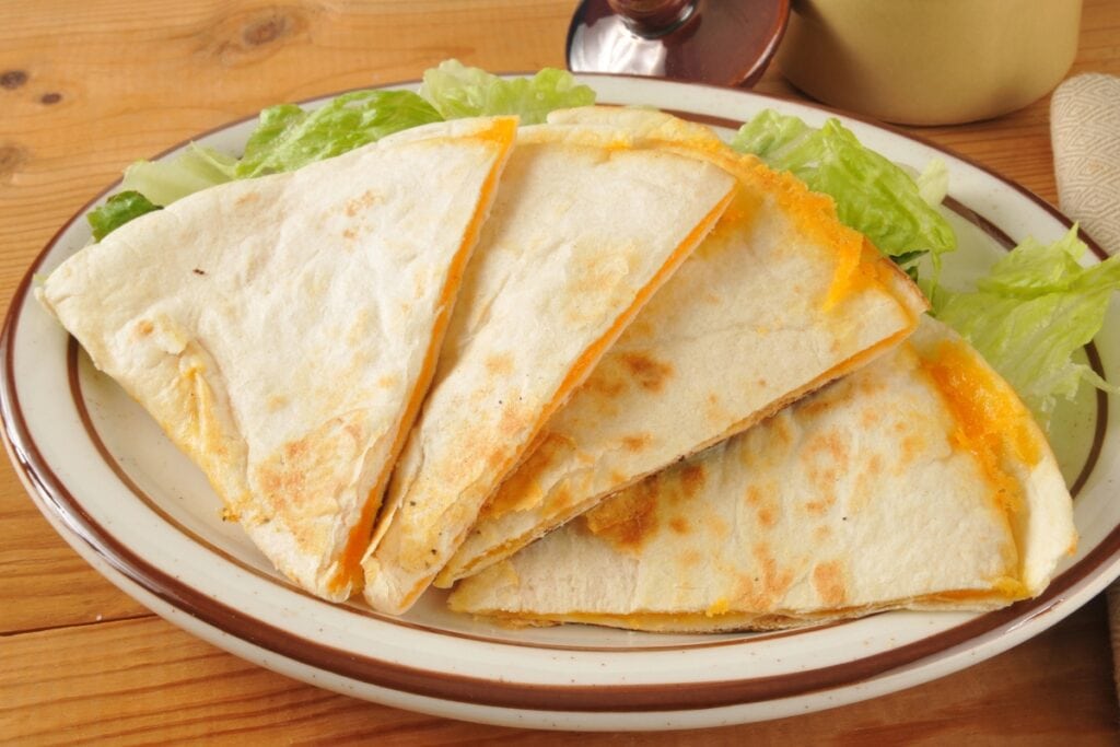 Cheese quesadillas on a plate.