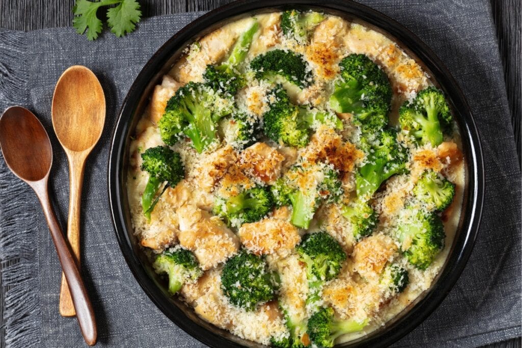 Chicken Divan in a round black baking dish.