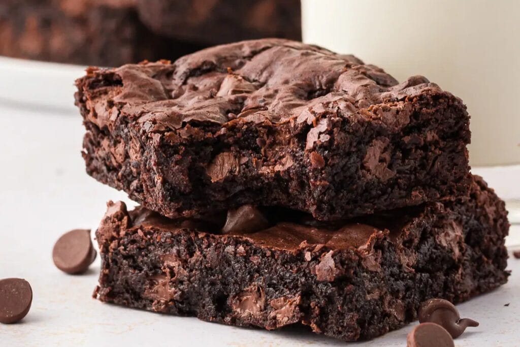 Cocoa powder brownies on a plate.
