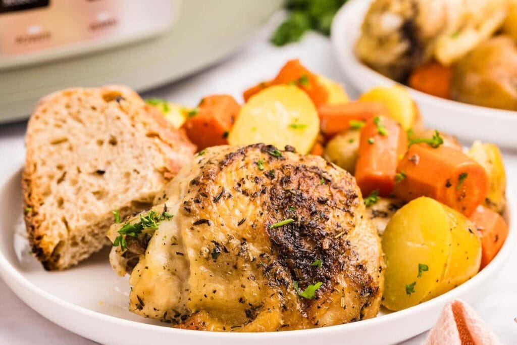 Crockpot chicken and potatoes on a plate.