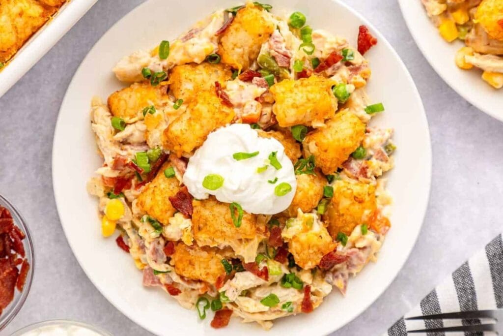 Easy cheesy loaded chicken tater tot casserole on a plate.