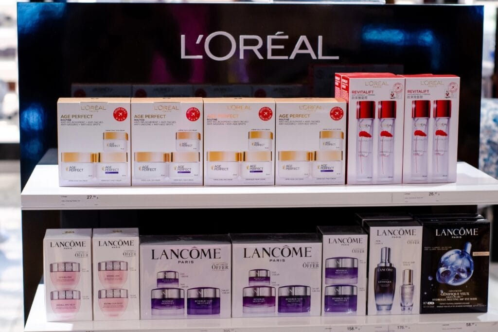 L’Oréal beauty and skincare products neatly arranged on a store shelf.
