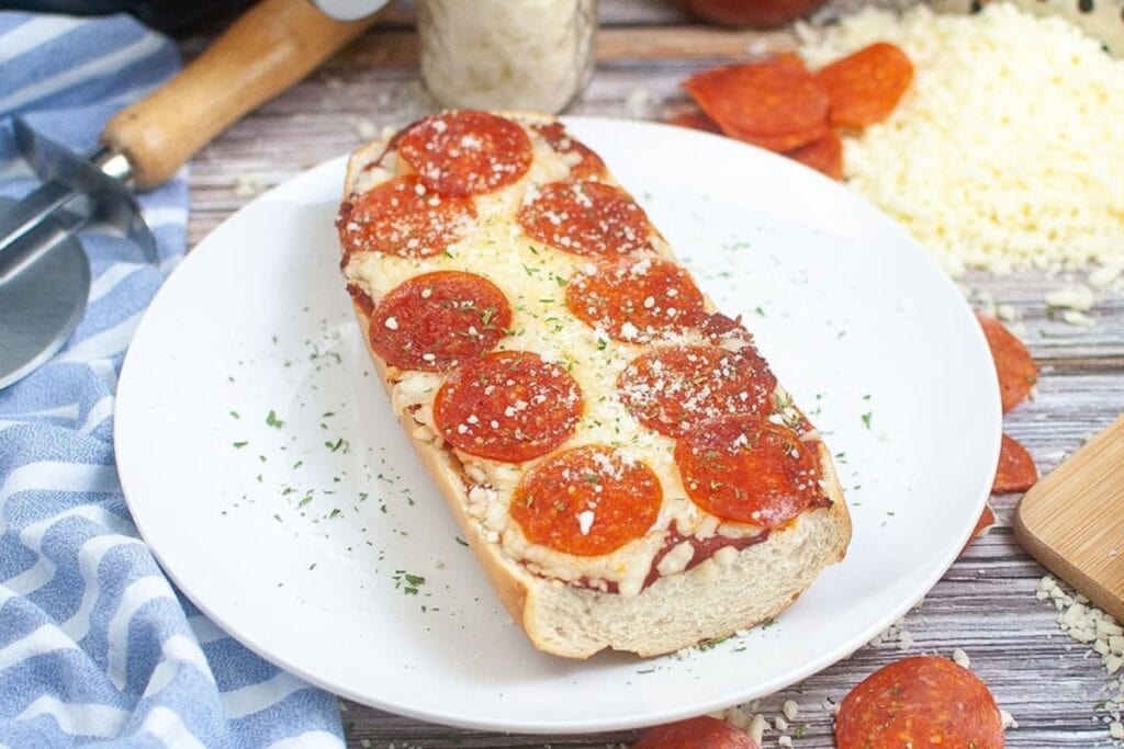 French Bread Pizza on  a white plate.