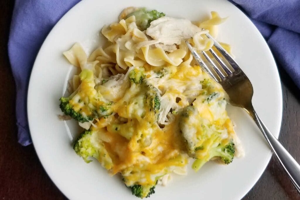 Grandma's chicken broccoli casserole on a plate with a fork on the side.