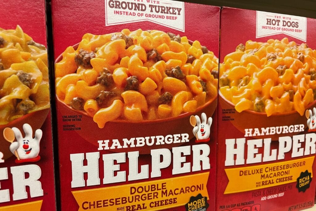 Boxes of Hamburger Helper arranged on a grocery store shelf.