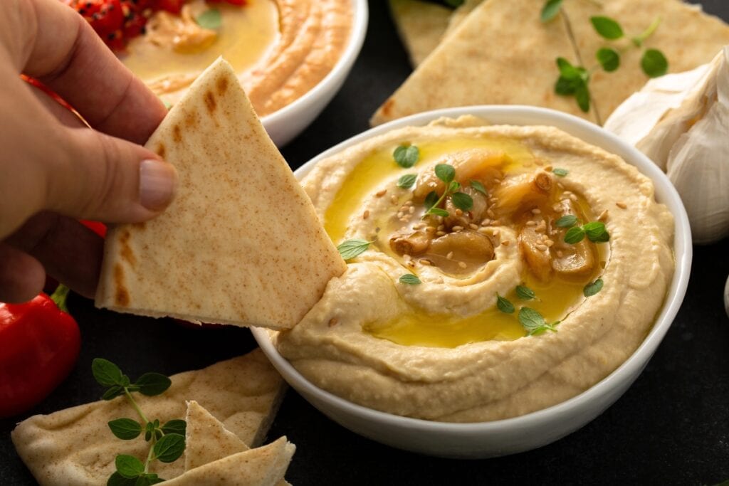 Hummus in a white bowl.