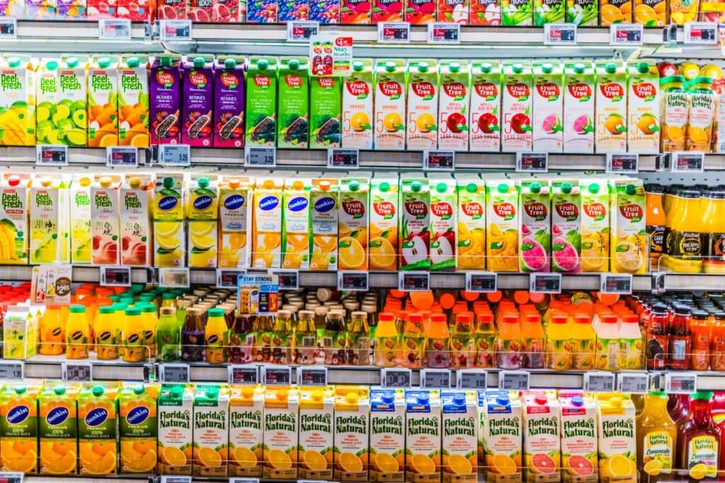 Juice boxes neatly displayed on a shelf.