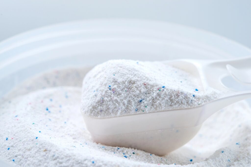 Scoop filled with laundry detergent.