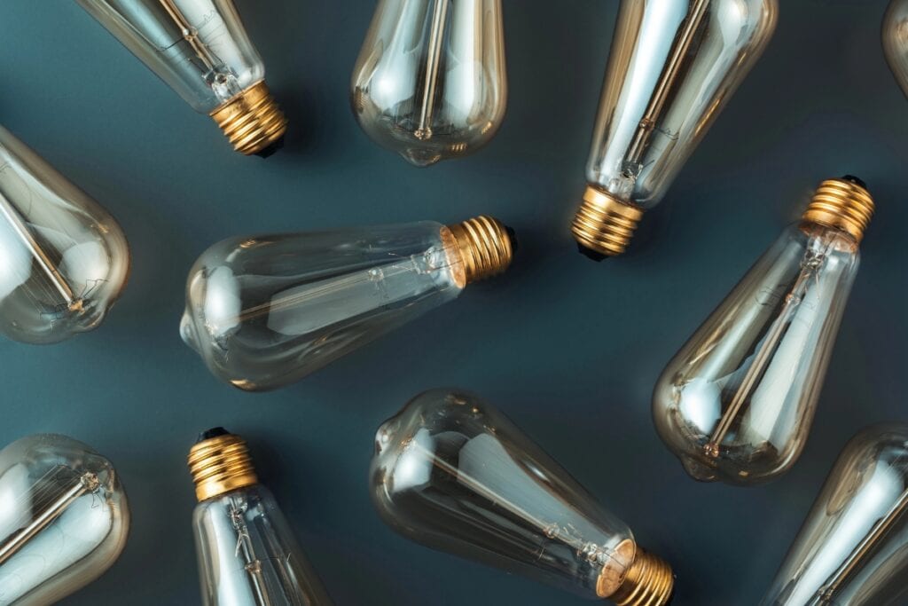 Light bulbs placed on a gray surface.