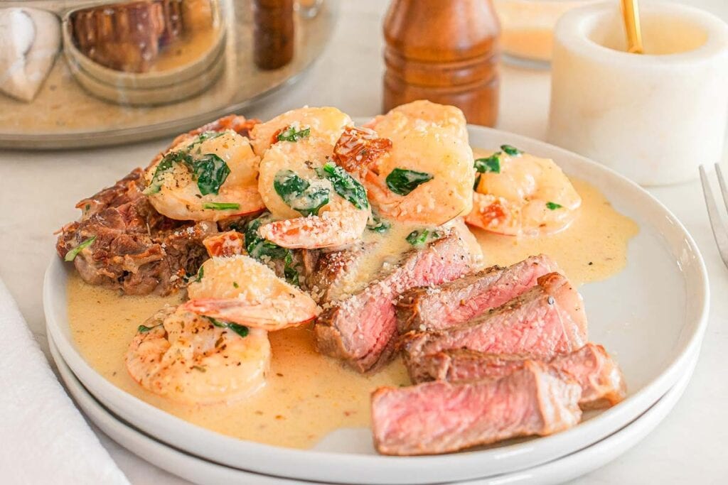 Marry Me surf and turf with creamy sauce, served on a white plate.