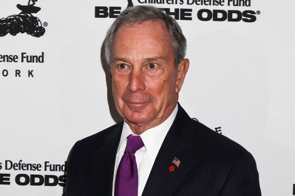 Side profile of Michael Bloomberg wearing a suit.