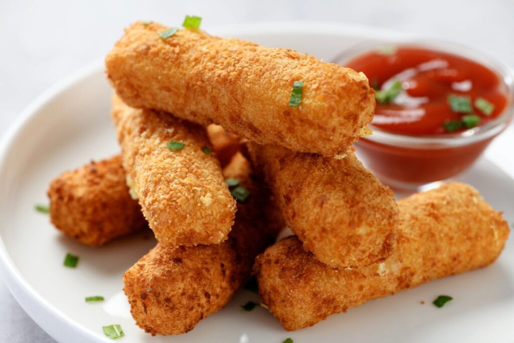 Mozzarella sticks on a plate.