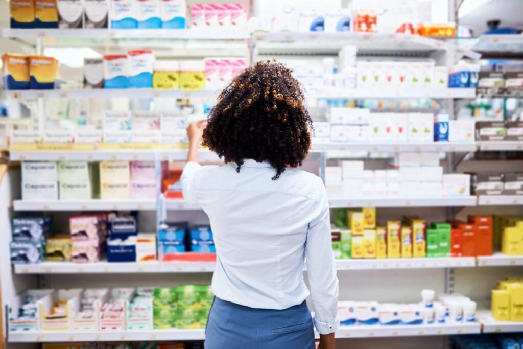 Woman shopping for over-the-counter medications.