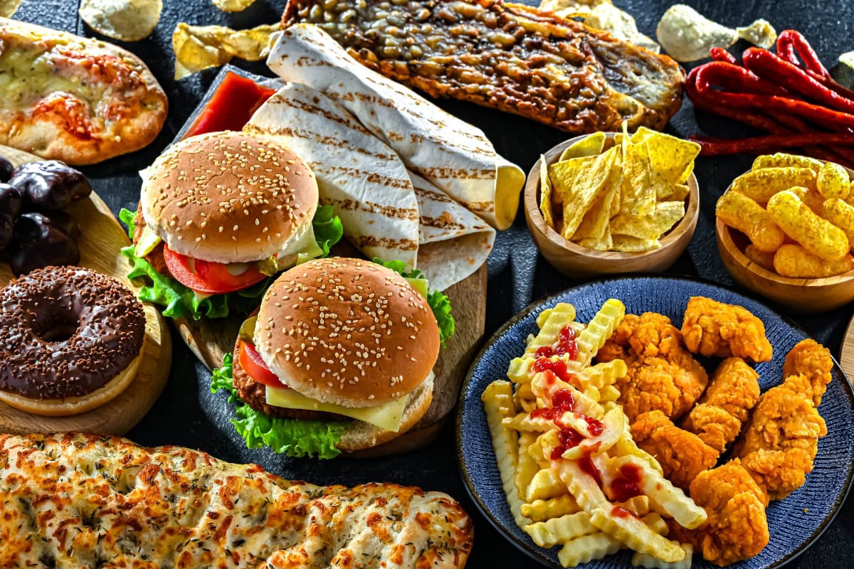 Variety of fast foods arranged on a table.