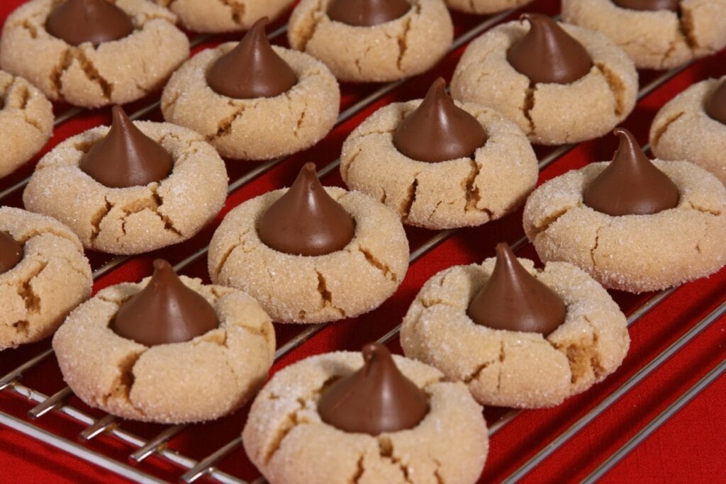 Peanut butter blossom cookies on a cooling rack.
